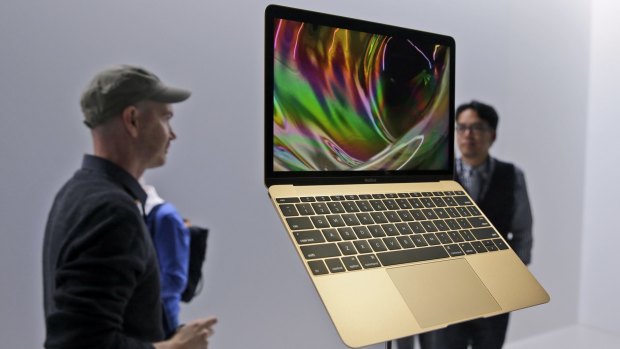 Members of the media and Apple guests get a look at the new MacBook.