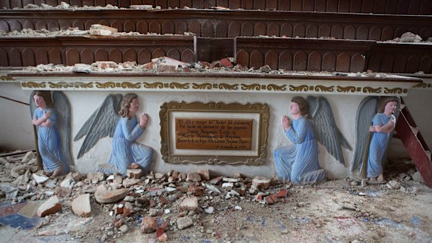 Debris lies inside the earthquake damaged 17th century Templo del Senor del Calvario church in Chiapa de Corzo, Mexico.