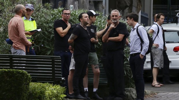 Ben Milgate looks on with his staff outside his restaurant Porteno in Surry Hills.

