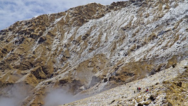 Trekkers below Kopra Ridge in the Annapurnas Kopra, in Nepal.

