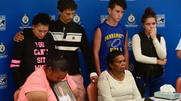 Johann Morgan's four children at the rear, Tamika, Michael, Steven and Rhonda Morgan with Inspector Phil O'Reilly and, Johann's sisters, Vivienne and Yvonne seated, appealed for information to find the missing mother several weeks after she disappeared. . 