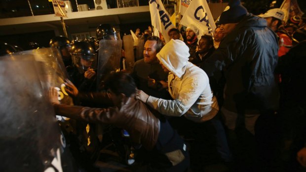 Lasso supporters clash with police near in Quito, on Sunday, as Moreno was declared the winner.