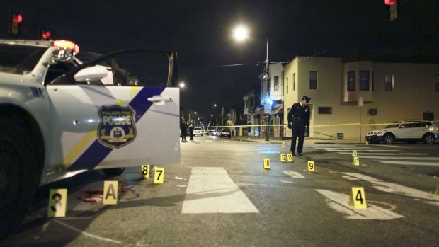 Attacker motivated by Islamic State ... A Philadelphia police officer was shot three times by a man who ambushed him as he sat in his marked police cruiser, authorities said.