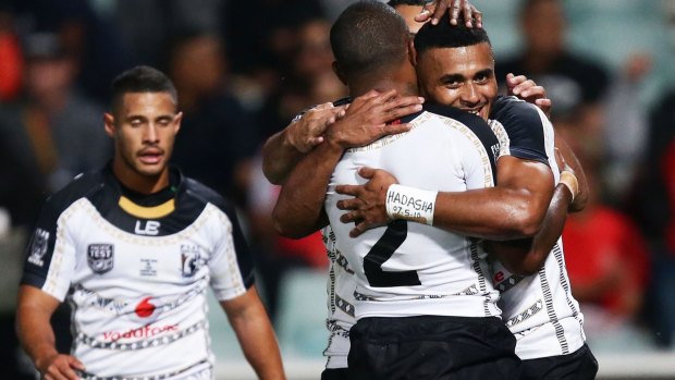 Touchdown: Fiji's Etuate Tamanikaitai Qionimacawa celebrates with teammates after scoring a try during the Test against PNG on Saturday.