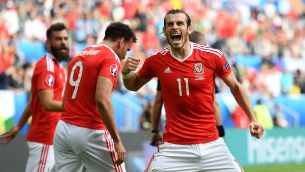 Pumped up: Gareth Bale celebrates his team's second goal scored by Hal Robson-Kanu.
