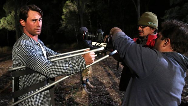 Actor Ben Chisholm with crew on set of the film Red Billabong. 