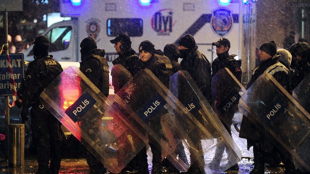 Riot police officers stand guard. The attack occurred in the Sultan Ahmet district, a popular tourist destination.