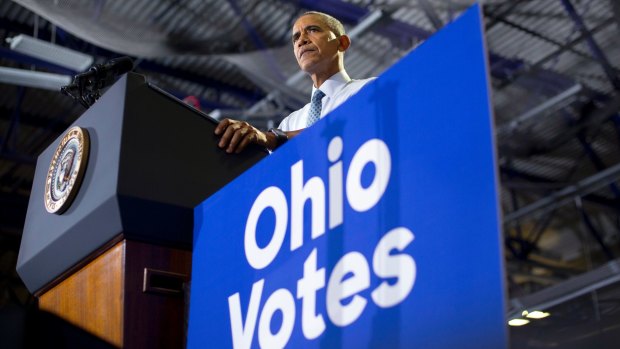 President Barack Obama pauses while speaking at Capital University Field House in Columbus, Ohio, on Tuesday.