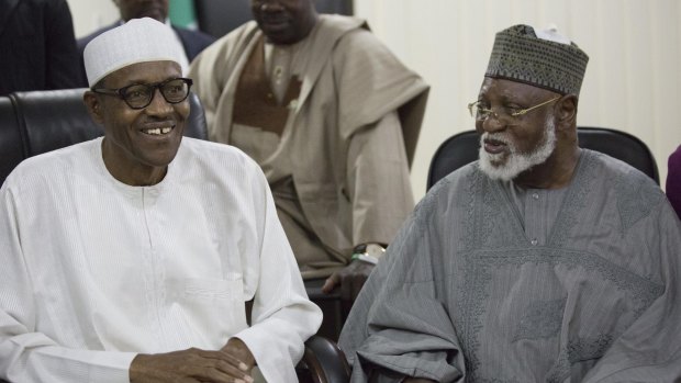 Nigerian President Muhammadu Buhari, left, with former president Abdulsalami Abubakar, last year.