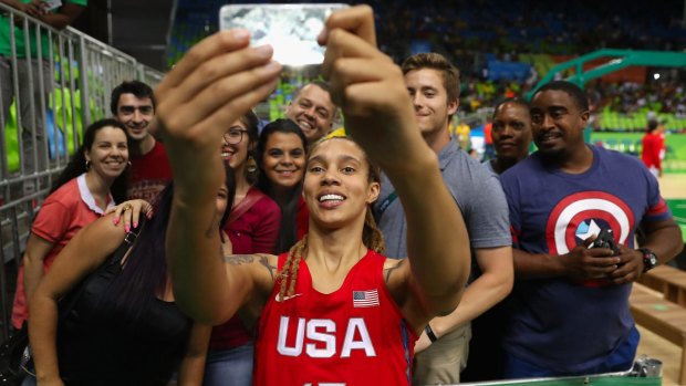 Popular: Brittney Griner poses for a selfie with fans after defeating Spain in the women's basketball game on Day 3 of the Rio 2016 Olympic Games.