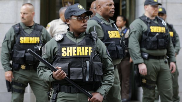 Members of the Baltimore City Sheriff''s Office stand guard outside a courthouse after Officer Caesar Goodson, one of six Baltimore city police officers charged in connection to the death of Freddie Gray, was acquitted.