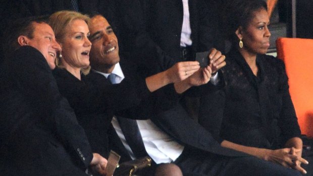 Danish PM Helle Thorning-Schmidt snaps a selfie with British PM David Cameron and US President Barack Obama. 