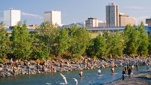 Visitors don’t have to travel far to be in touch with nature: anglers line Ship Creek in the downtown region.