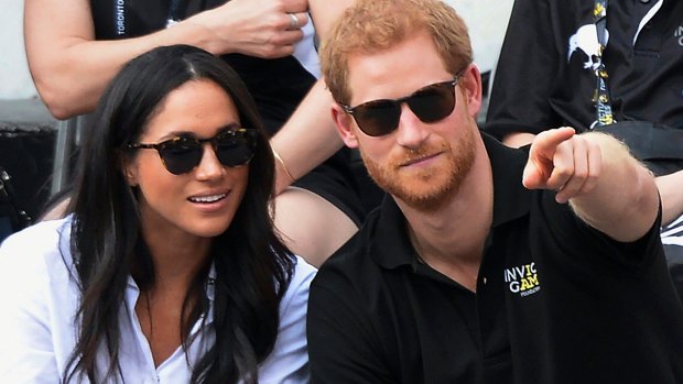 Prince Harry and his now-fiancee Meghan Markle attend the wheelchair tennis competition during the Invictus Games in Toronto.