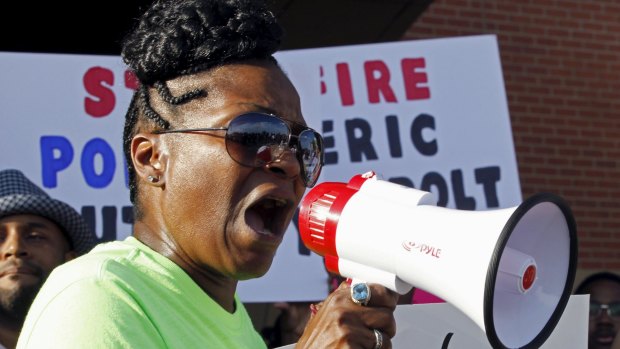 A woman speaks during a protest against what demonstrators call police brutality in McKinney, Texas.