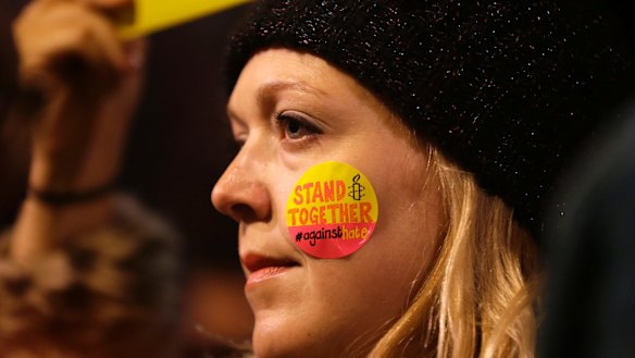A demonstrator takes part in a protest against US President Donald Trump's controversial travel ban on refugees  outside Downing Street in London.