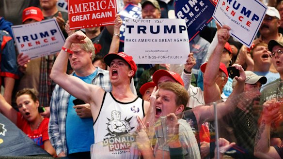 Ardent supporters: Fans cheer for Republican presidential candidate Donald Trump at a rally in Wilkes-Barre, Pennsylvania.