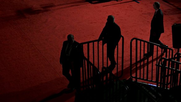 Men walk through the debate hall ahead of the second US. presidential debate in St. Louis, Missouri.