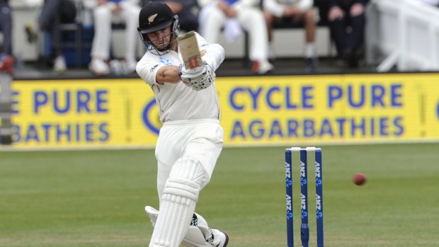 Head down, eyes on the ball: New Zealand's Kane Williamson plays a copybook stroke on day three of the Test.