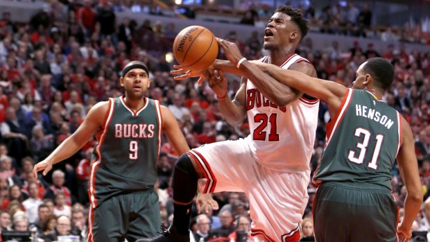 Much improved player: Chicago Bulls guard Jimmy Butler is fouled by Milwaukee Bucks centre John Henson.