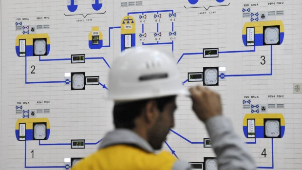 An Iranian operator monitors the nuclear power plant unit in Bushehr, about 1200 km south of Tehran.