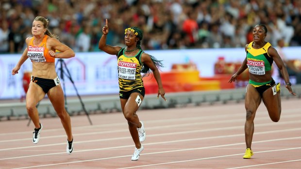 Shelly-Ann Fraser-Pryce of Jamaica (centre) beats Dafne Schippers of the Netherlands (left) and Veronica Campbell-Brown of Jamaica to win the women's 100 metres final on Monday.