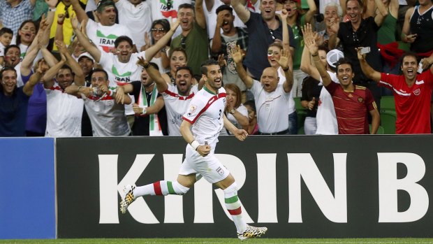Iranian fans celebrate Ehsan Haji Safi's goal on Sunday.