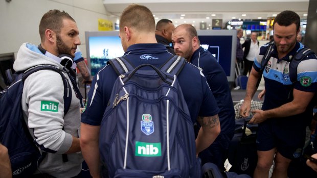 Shattered: Boyd Cordner, right, and Blues teammates arrive back at Sydney Airport on Thursday afternoon after their crushing defeat. 