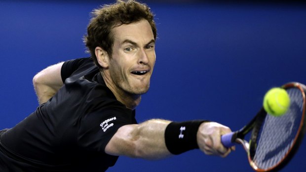 Full stretch: Andy Murray makes a backhand return to Tomas Berdych.