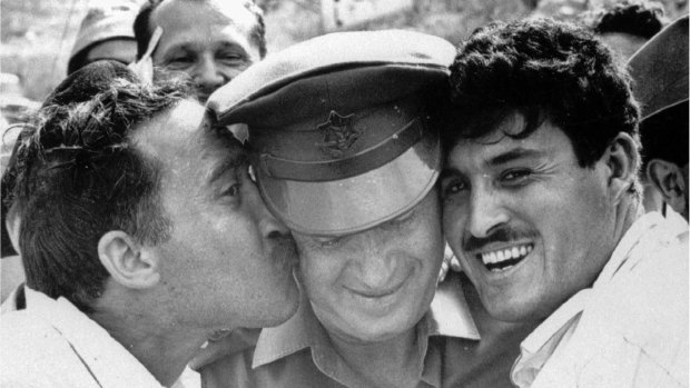 Yitzhak Rabin, centre, then Israel Defence Forces chief of staff, is greeted by jubilant Israelis after the fall of east Jerusalem to Israeli forces in June 1967.  