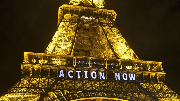 The Eiffel Tower lit up during the UN climate conference in Paris in 2015.