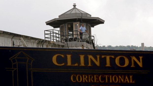 A guard stands in a tower at the Clinton Correctional Facility in Dannemora, New York.