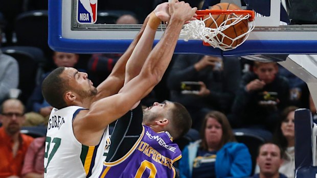 Jazz centre Rudy Gobert dunks on Kings centre Isaac Humphries.