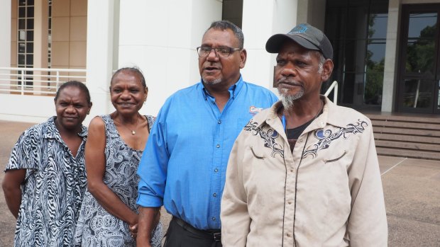 From left: Kenbi traditional owner Zoe Singh, sister Raylene Singh, NLC chairman Samuel Bush-Blanasi and traditional owner Jason Singh are all smiles outside NT Parliament House in Darwin, after the Kenbi Land Claim settlement was announced.
