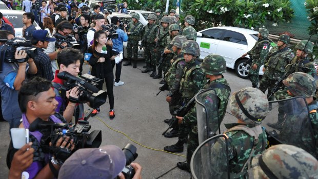 Journalists and the military in a face-off in Bangkok in 2014. 