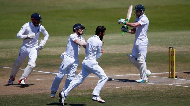 Moeen Ali of England (second from right) celebrates after dismissing A.B. de Villiers of South Africa soon after play began on the final day of the first Test on Wednesday.