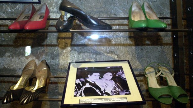 A photo of the former First Lady Imelda Marcos with Prince Charles, alongside some of her incredible collection of shoes.