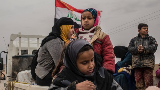 An Iraqi family who have fled fighting as Iraqi forces advance into Islamic State-controlled west Mosul.