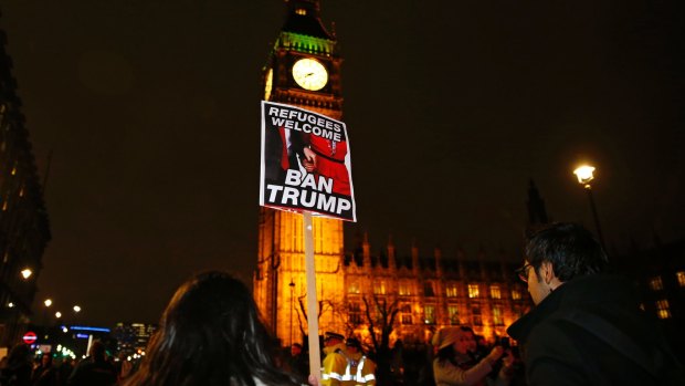 Protesters pass the Big Ben in London.