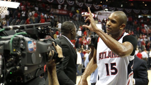 Salute: Hawks centre Al Horford celebrates the win against the Washington Wizards after Game Five.