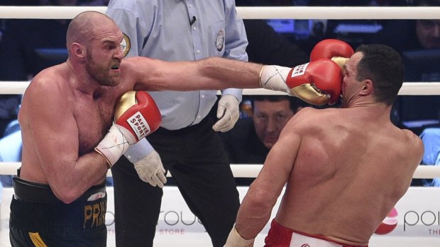 New champ: Tyson Fury lands a left on Wladimir Klitschko during their title fight.