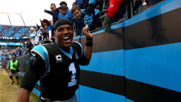 No.1: Carolina star Cam Newton celebrates with Panthers fans after defeating the Cleveland Browns 17-13.