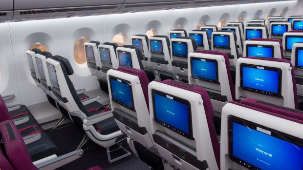 Economy class on board a Qatar Airways Airbus A350. The airline has increased flights to Australia as other carriers suspend services. 