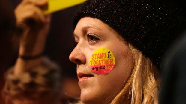 A demonstrator takes part in a protest against US President Donald Trump's controversial travel ban in London.