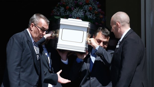 Mourners carry the coffin of the Rozelle blast victims Bianka and Jude O'Brien. 