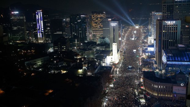 Protesters gather and occupy major streets in the city centre for a rally against South Korean President Park Geun-hye.