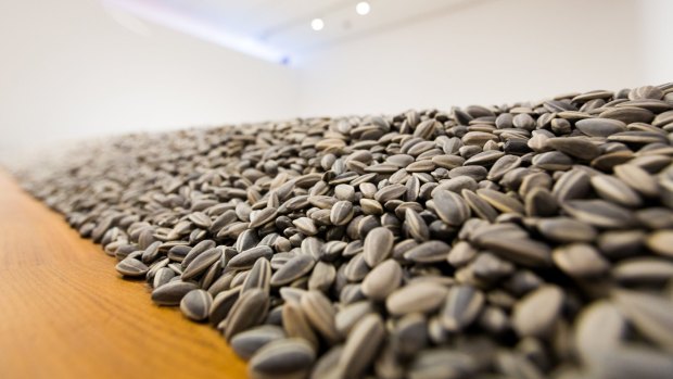 Notable artists such as Ai Weiwei, who created <i>Sunflower Seeds</I>, appear in the exhibition.