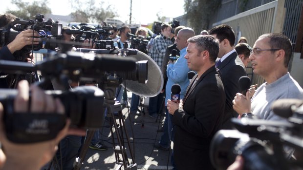 The media pack at the entrance to Maasiyahu Prison for the arrival of former Israeli prime minister Ehud Olmert .