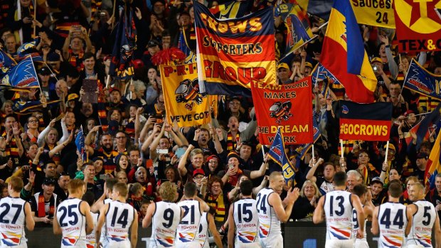 Off to a flyer: Crows players thank fans after their elimination final win against the Bulldogs.