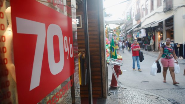 A sign advertises 70 per cent discounts in the Saara discount shopping district of Rio de Janeiro, on Tuesday.